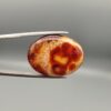 Natural Fire Agate oval cabochon 25.74 carat with yellow orange and red mottled pattern from Iran