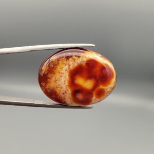 Natural Fire Agate oval cabochon 25.74 carat with yellow orange and red mottled pattern from Iran