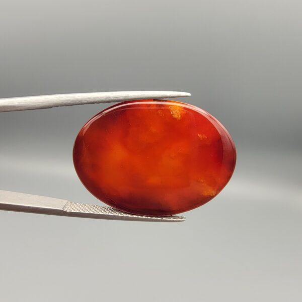 Natural Fire Agate oval cabochon 25.74 carat with yellow orange and red mottled pattern from Iran