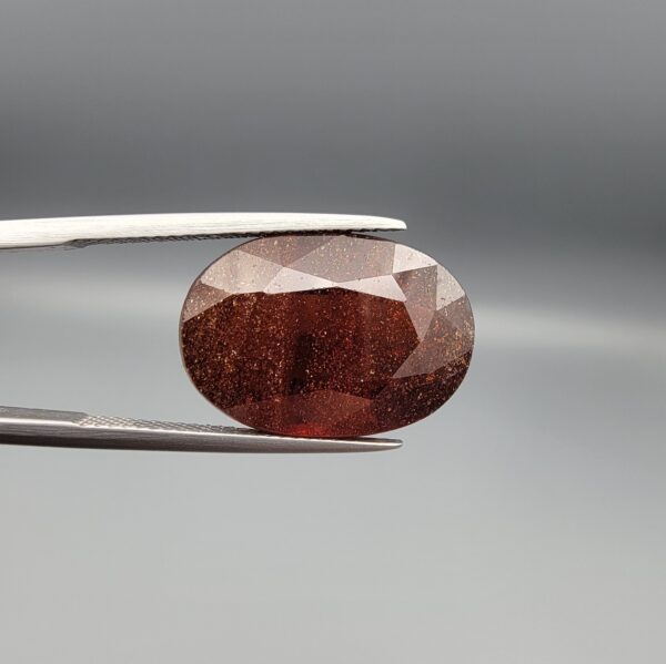 Natural deep red-brown Hessonite Garnet Gomed oval cut gemstone 19.38 carat, untreated January birthstone