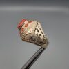 Studio close-up photographs showing the top and side profile views of a handcrafted 925 sterling silver ring featuring a natural Italian coral center stone and matching coral side accents.