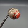 Studio close-up photographs showing the top and side profile views of a handcrafted 925 sterling silver ring featuring a natural Italian coral center stone and matching coral side accents.