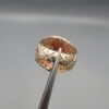 Studio close-up photographs showing the top and side profile views of a handcrafted 925 sterling silver ring featuring a natural Italian coral center stone and matching coral side accents.