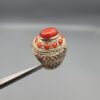 Studio close-up photographs showing the top and side profile views of a handcrafted size 22 solid 925 sterling silver ring featuring a natural Italian coral center stone and matching coral side accents.