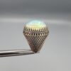 Studio close-up photographs showing the top and detailed side shank views of a 10+ carat natural Ethiopian opal ring crafted in solid sterling silver with an intricate Turkish design.
