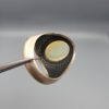 Studio close-up photographs showing the top and detailed side shank views of a 10+ carat natural Ethiopian opal ring crafted in solid sterling silver with an intricate Turkish design.