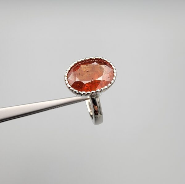 Studio close-up photographs showing the top oval face, 925 stamp, 6.12 weight hallmark, and side profile settings of a natural hessonite gomed sterling silver ring.