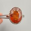 Studio close-up photographs showing the top oval face, 925 stamp, 6.12 weight hallmark, and side profile settings of a natural hessonite gomed sterling silver ring.