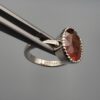 Studio close-up photographs showing the top oval face, 925 stamp, 6.12 weight hallmark, and side profile settings of a natural hessonite gomed sterling silver ring.