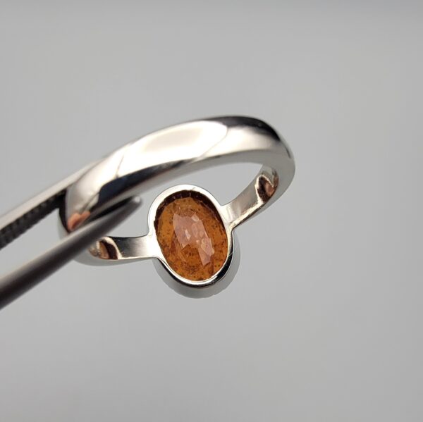 Studio close-up photographs showing the top oval face, 925 stamp, 6.12 weight hallmark, and side profile settings of a natural hessonite gomed sterling silver ring.