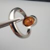Studio close-up photographs showing the top oval face, 925 stamp, 6.12 weight hallmark, and side profile settings of a natural hessonite gomed sterling silver ring.