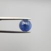 Studio close-up photographs showing the top table face and reverse natural mountain formation features of a 3.17 carat round cut natural blue sapphire loose gemstone held in precision tweezers.