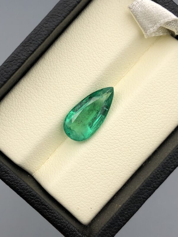 Digital image of a Galaxy Gemological Institute Gemstone Report (Certificate # KHI2609130183) dated September 8, 2026, detailing a 3.69 Carat Pear & Mixed Cut Natural Emerald with transparent green color.