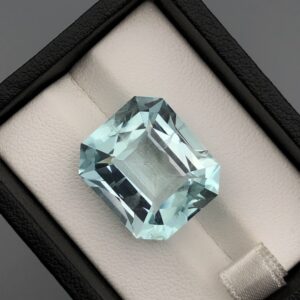 Digital image of a Gemstone Report from The Gemstone Company (Report # TGC-20260828-4529) dated August 28, 2026, signed by GIA Graduate Gemologist Muhammad Momin. It details a 22.34 Carat Octagonal Mixed Cut Natural Aquamarine with transparent greenish-blue color.