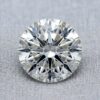 Official GIA Natural Diamond Dossier scan for a 0.61-carat round brilliant loose diamond, detailing report number 1318972900, G color grade, SI2 clarity grade, Excellent cut grade, Excellent polish, Excellent symmetry, None fluorescence, and laser inscription GIA 1318972900.