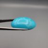 Magnificent 53.10 carat natural vibrant sky-blue Sleeping Beauty turquoise (Razaki Feroza) from Kerman, Iran, styled into an oval cabochon featuring a rich textured finish and an organic mottled host matrix reverse.