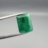 Multi-angle macro photographs of a 6.34-carat natural emerald (Panna / Zamrud) from the Swat Valley in Pakistan held in metal tweezers, showcasing an emerald cut, a vibrant green body, and characteristic internal crystal inclusions.
