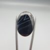 Multi-angle macro photographs of a 26.54-carat natural black banded agate (Sulemani Aqeeq) oval cabochon held vertically in metal tweezers, displaying a mirror-polished deep obsidian black surface accented by sharp V-shaped geometric chevron lines and fine parallel fortification banding.