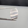 Exceptional 18.37 carat natural banded agate (Sulemani Aqeeq), expertly polished into an oval cabochon displaying delicate monochrome horizontal banding reminiscent of a serene wind-swept horizon.