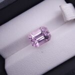 High-resolution digital scan of an official Galaxy Gemological Institute (GGI) Gemstone Report certificate (No. KHI2610220416) dated 14 October 2026 for a 5.68-carat unenhanced transparent pink natural Kunzite (Spodumene) from Afghanistan cut in an emerald step cut.