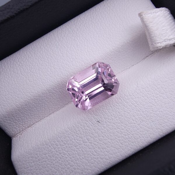 High-resolution digital scan of an official Galaxy Gemological Institute (GGI) Gemstone Report certificate (No. KHI2610220416) dated 14 October 2026 for a 5.68-carat unenhanced transparent pink natural Kunzite (Spodumene) from Afghanistan cut in an emerald step cut.