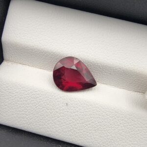 Majestic 3.72 carat natural Madagascan Rhodolite Garnet displaying an elegant pear cut with deep raspberry-red body color, exceptional crystal clarity, and subtle purplish-rose fire.