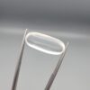 Multi-angle macro photographs of a 9.56-carat natural Durr-e-Najaf (Clear Rock Crystal Quartz) cabochon held vertically in stainless steel gem tweezers and resting on fingers, displaying an elegant slender elongated oval dome, water-clear transparency, and subtle organic internal veil growth.