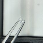 Official Diamond Report card scan from NY. Gemological Institute for a 0.05-carat round brilliant loose natural diamond, detailing report number NYDGR64-7863203 (dated Oct 26 2026), H color, VVS2 clarity, Very Good cut, Very Good polish/symmetry, None fluorescence, and measurements 2.35-2.36x1.50 mm.
