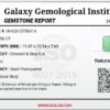 High-resolution digital scan of an official Galaxy Gemological Institute (GGI) Gemstone Report certificate (No. KHI2610700414) dated 14 October 2026 for a massive 19.56-carat semi-transparent green natural Emerald (Beryl) featuring an emerald step cut with moderate oiling.